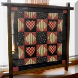 A42. Framed quilt.
